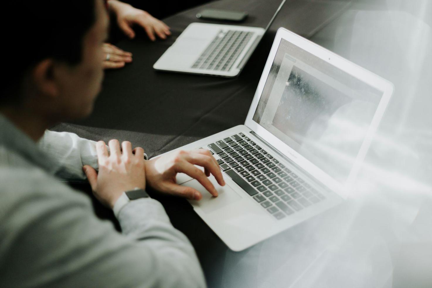 Business professional reviewing financial documents during webinar session