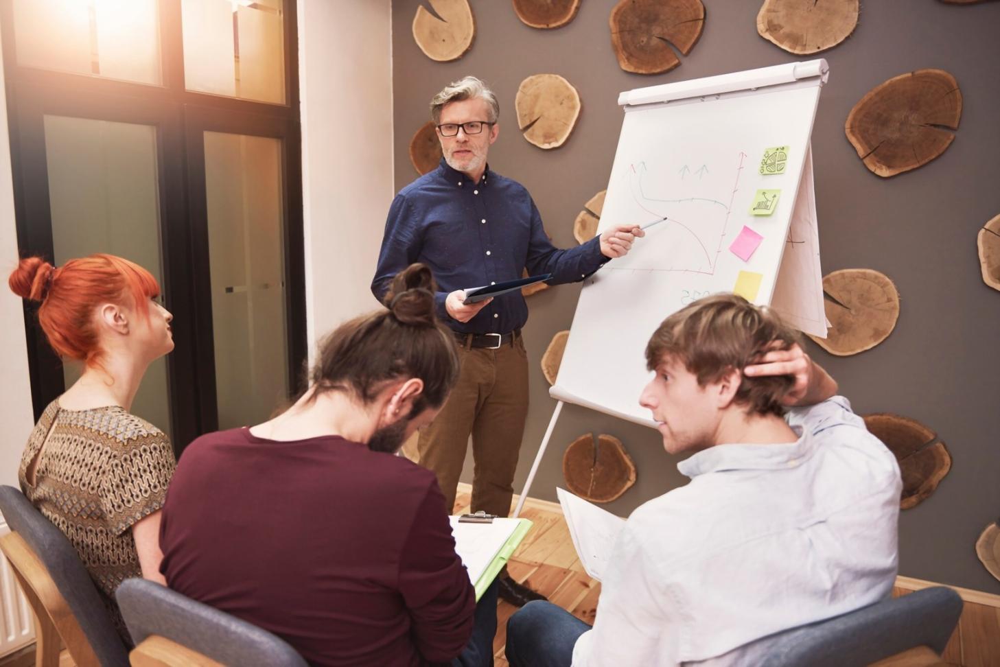 Financial analyst reviewing presentation materials with clear data visualization